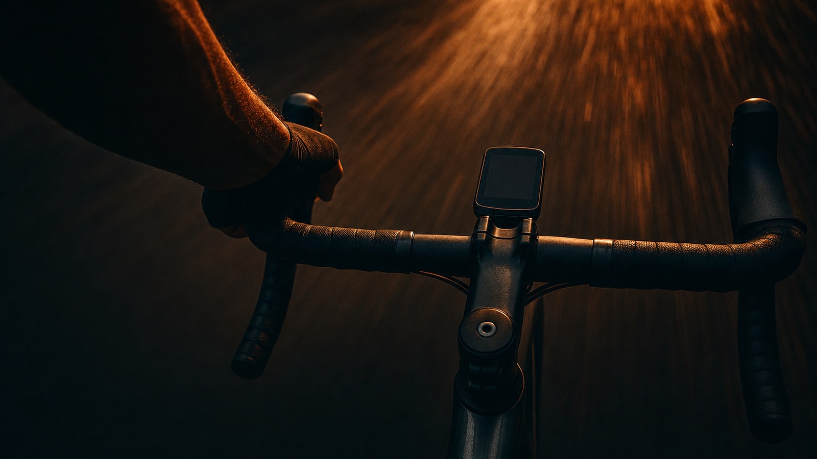 A cyclist's view over the handlebars at speed: long-course race pace lives below threshold, not at it